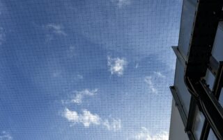 50mm pigeon netting installed over rooftop plant room at school, Milton Keynes